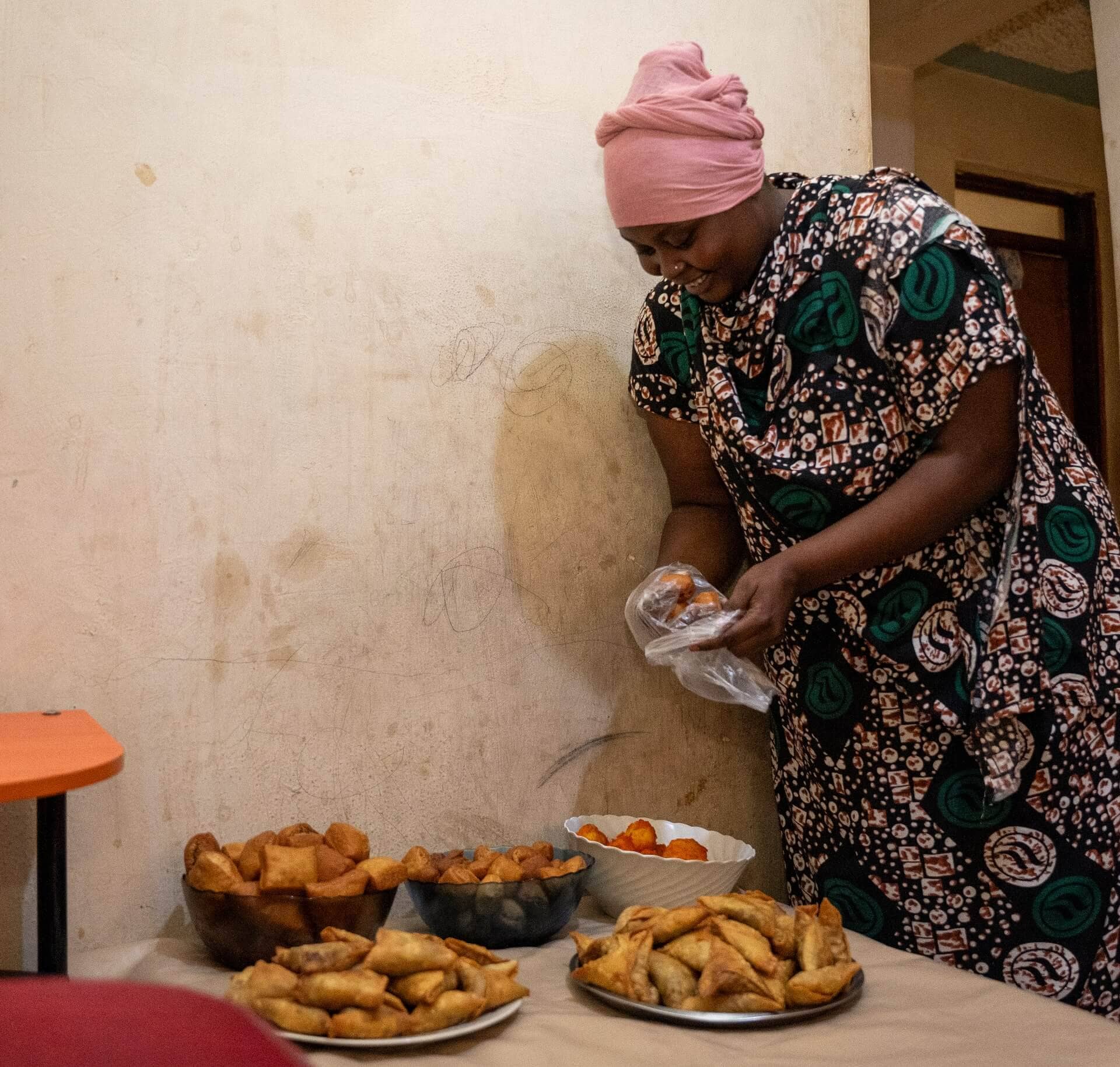 Zamzam Ibrahim prepares snacks at their home in Nairobi. Zamzam is a member of Tawakal USLA Group which is been facilitated by the ReBUiLD Program for linkages to formal financial service providers